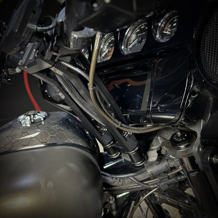The TC Bros. Pro Series Riser Adapter for 2006-2023 Harley Davidson Street Glide features a black metal bracket with two threaded holes, silver washers, and gold bolts—shown on a white background. Perfect for performance upgrades.