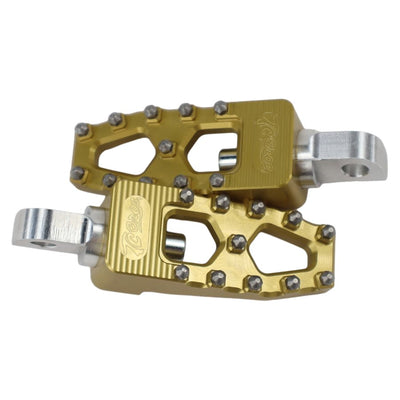 A pair of TC Bros. Pro Series Gold MX Lite Foot Pegs for Harley Davidson Models on a white background, providing high traction for the Harley Davidson rider.