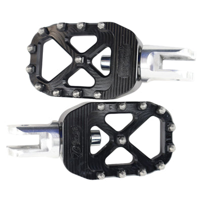 A pair of black TC Bros. Pro Series Black MX Rider Foot Pegs for 2018-newer Harley Softail & Pan America, providing high traction and stability.
