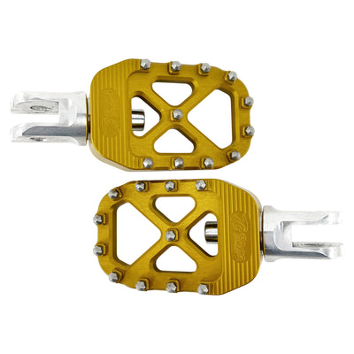 A pair of TC Bros. Pro Series Gold MX Rider Foot Pegs on a white background.