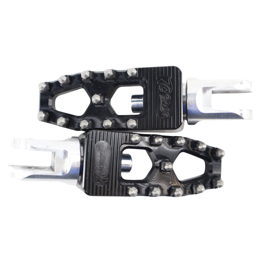 A pair of TC Bros. Pro Series Black MX Lite Rider Foot Pegs on a white background.