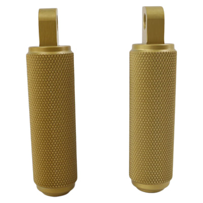 A pair of TC Bros. Nomad Foot pegs for Harley Models - Knurled - Gold handlebar grips providing traction and stability on a white background.