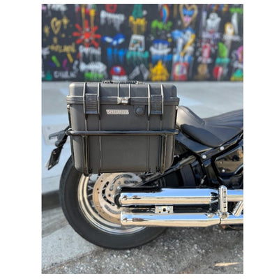 Two black, waterproof Speedwell Vigilante Saddlebags - Harley M8 Softail (with tail light/turn signal kit) with handles, one open and one closed, displayed against a white background.