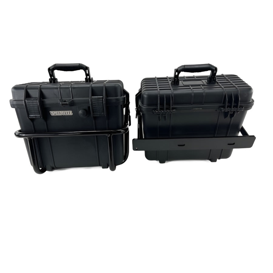 Two black, rugged, waterproof Speedwell Vigilante Saddlebags with sturdy handles, displayed against a white background.