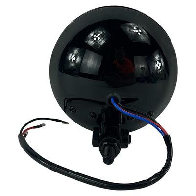 A powerful Moto Iron® 4" Chopper Headlight - Black Clear Lens with a wire attached to it.