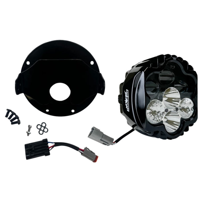 The Shark Demon™ 2 Performance LED Headlight Kit by Custom Dynamics is a round, black, DOT compliant headlight with an attached wiring harness and connectors. It also includes a separate mounting bracket with screws and rubber grommets, making it perfect for those seeking a reliable upgrade for their &