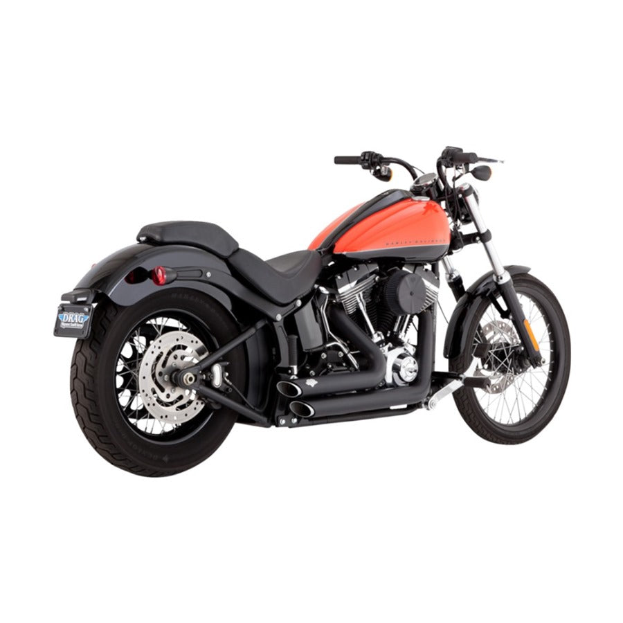 A black and orange motorcycle with a Vance & Hines Shortshots Staggered Exhaust System on a white background.