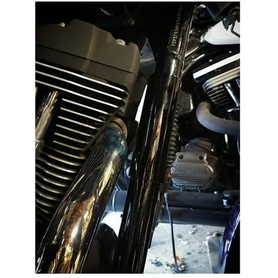 A close up of a motorcycle engine with an Invisivin Magnetic Vin Sticker Cover from the 1999-2005 Dyna Stepped frame.