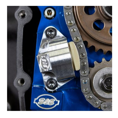 A blue gearbox with a chain, gears, and S&S Cycle Hydraulic Cam Chain Tensioner Kit for 2007-'16 HD® & 2006 Dyna® Big Twins.