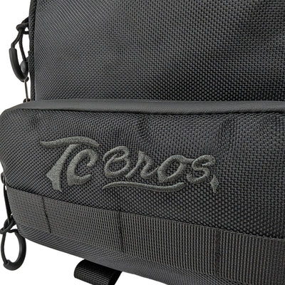 A black TC Bros. Motorcycle Handlebar Bag with the TC Bros. logo on it.