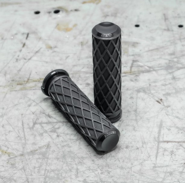 A pair of black Arlen Ness Fusion Diamond Grips on a table.