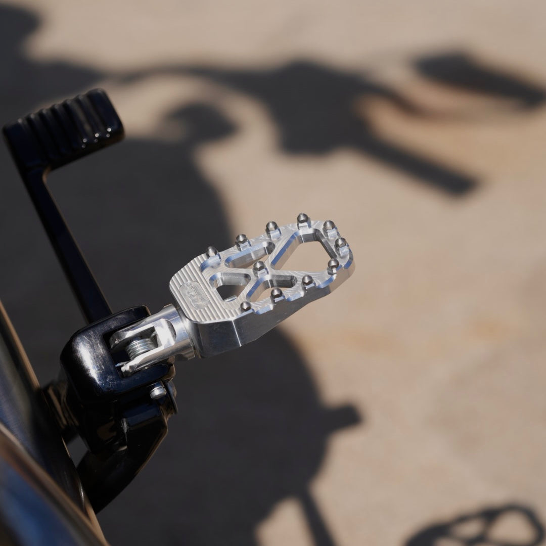 TC Bros., known for its high performance and traction, is a beloved brand among Harley Davidson riders, thanks to their TC Bros. Pro Series MX Rider Foot Pegs for 2018-newer Harley Softail & Pan America.