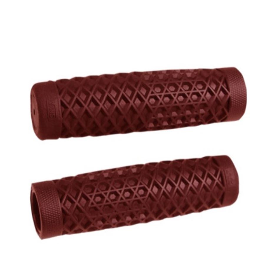 A pair of red rubber Vans + Cult Motorcycle Grips - 1" Red by ODI on a white background.