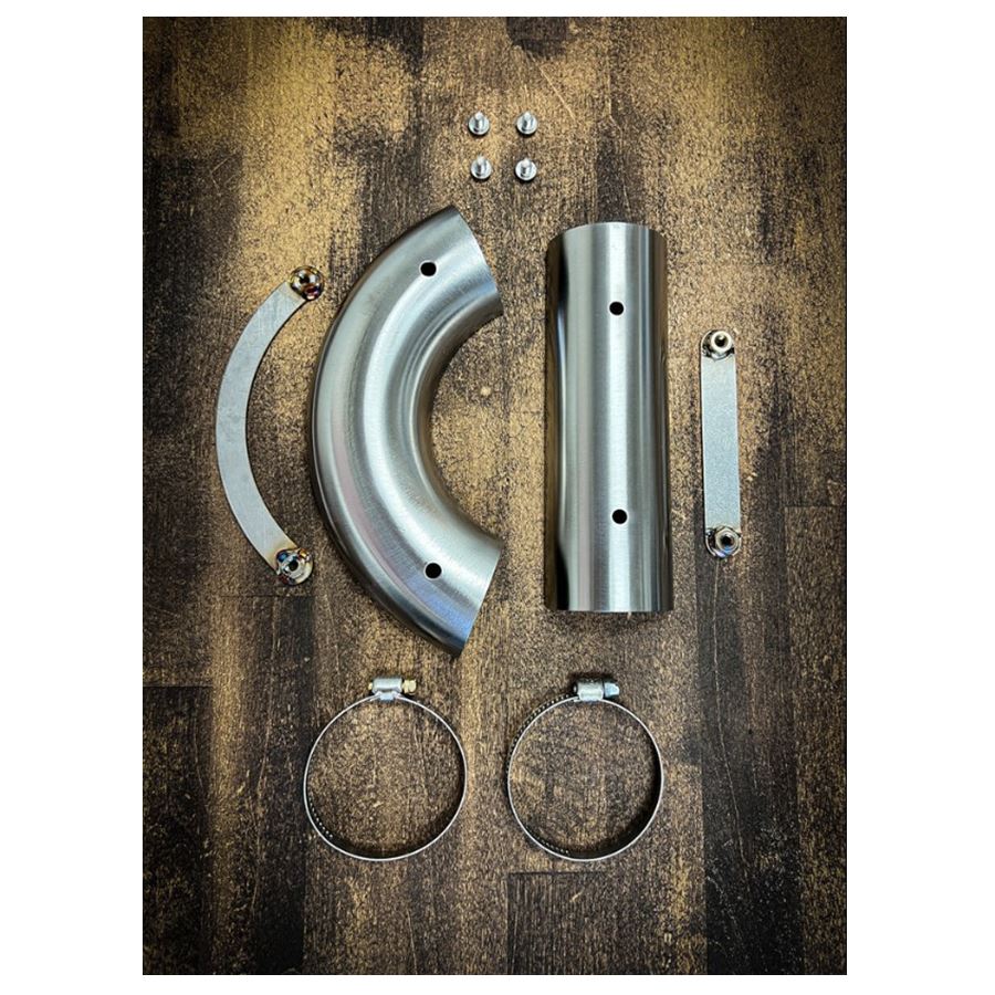 A set of SP Concepts Stainless Heat Shields for All M8 Softails & Baggers, 99-05 Dyna, 06-17 Dyna motorcycle exhaust fittings on a wooden table.