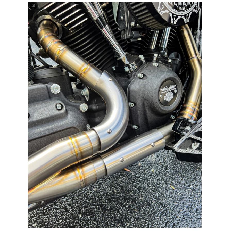 A close up of SP Concepts Stainless Heat Shields for All M8 Softails & Baggers, 99-05 Dyna, 06-17 Dyna, made with high quality materials.