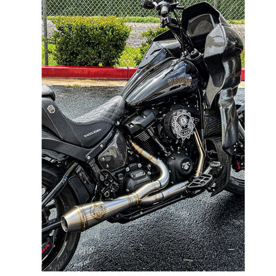 A high-quality SP Concepts Stainless Heat Shields for All M8 Softails & Baggers, 99-05 Dyna, 06-17 Dyna motorcycle parked in a parking lot, equipped with heat shields to protect the motorcycle exhaust.