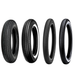 Four vintage-style car tires, including the Shinko 270 Super Classic Tire by Shinko, are displayed upright in a row on a white background, each with unique tread patterns and some featuring classic white sidewalls.