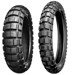 The Shinko 804/805 Adventure Trail Tire by Shinko, featuring a rugged tread for off-road use, is displayed upright against a white background.
