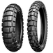 The Shinko 804/805 Adventure Trail Tire by Shinko, featuring a rugged tread for off-road use, is displayed upright against a white background.