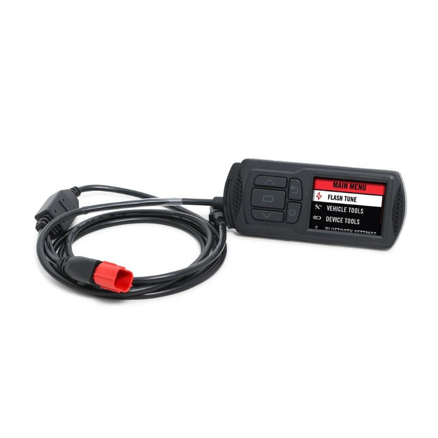 The Dynojet Power Vision 3 2021-2022 M8 Harley Softail/Touring MT22 ECU fuel tuner is a handheld electronic device with a screen displaying a menu and buttons for navigation, connected to a cable with a red plug, perfect for enhancing your Harley Softail&