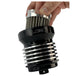 A person is holding a PC Racing Reusable Oil Filter For Harley 1980-2023 - Black on top of a white background.