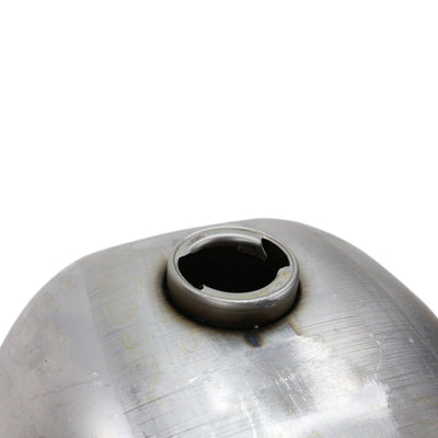A Moto Iron® 2.3 Gal Frisco Wassell Style Low Tunnel Chopper Gas Tank with a hole in it.