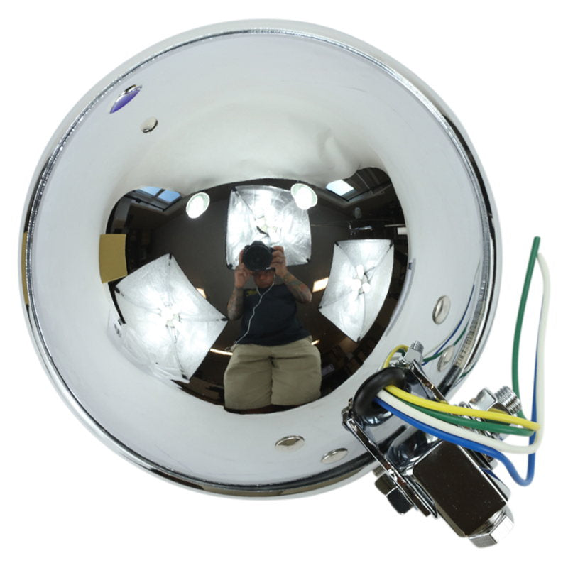 A person is standing in front of a Moto Iron® Bates Style Headlight 5.75" mirror.