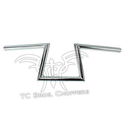 Two TC Bros. 1" Slant Z Handlebars - Chrome with the word TC Bros. Chopper, available in either dimpled or non-dimpled options.