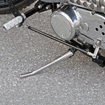 A close up of TC Bros Universal Linkage Kit metric forward control handlebars.