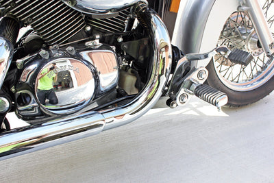 A close up of a motorcycle engine featuring the TC Bros. Honda Shadow ACE 750 Forward Controls Extension Kit 1998-2003 VT750 models, with a forward controls extension kit for optimal control. This high-quality engine is proudly made in the USA.