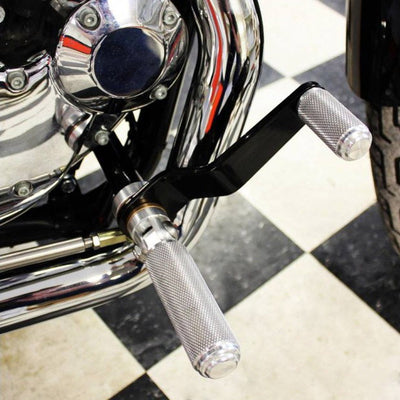 A close up of a TC Bros. Sportster Forward Controls Kit for 91-03 5 Speed motorcycle handlebar with bolt on forward controls.