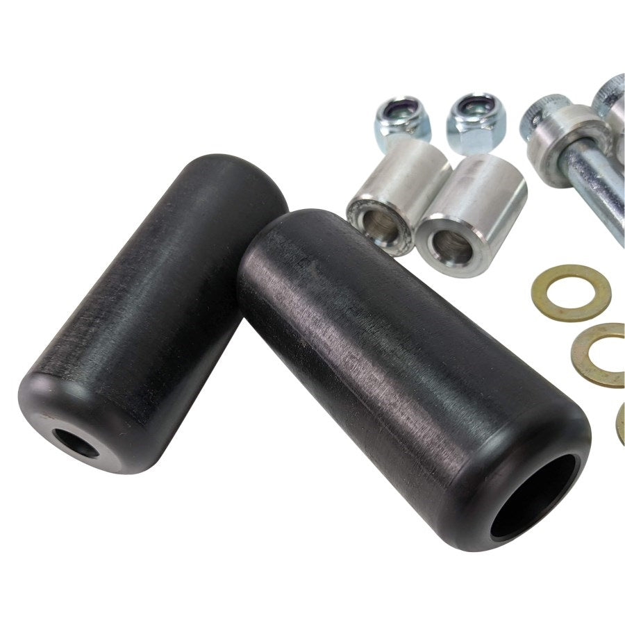 A pair of black rubber TC Bros. Upper Shock Mount Delrin Crash Sliders with nuts and bolts.