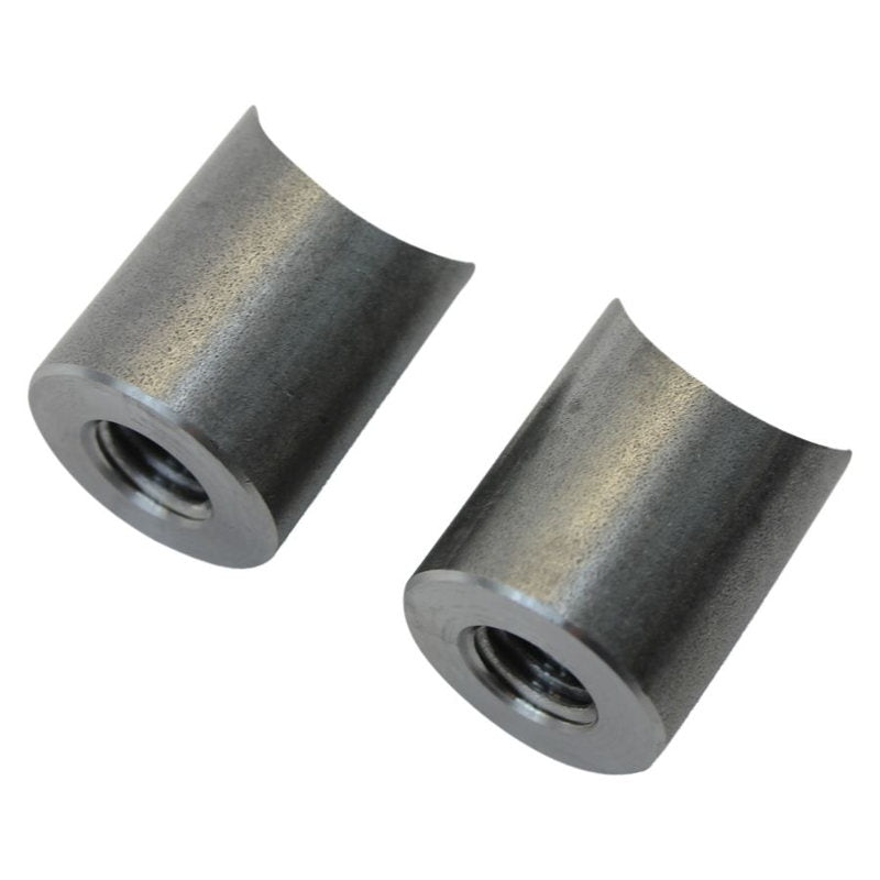 A pair of Coped Steel Handlebar Riser Bungs 1/2-13 Threaded by TC Bros on a white background for TC Bros.