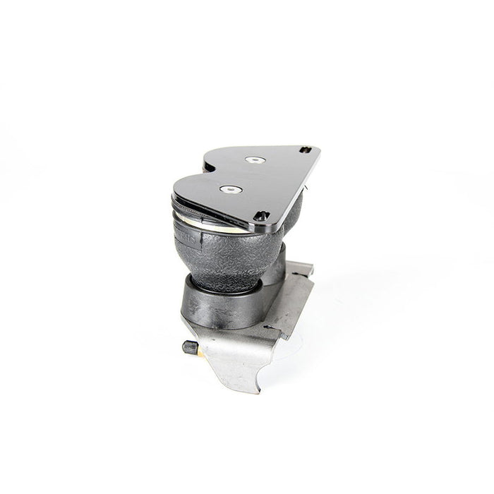 The TC Bros. Air Ride Solo Seat Kit - Single Bag by TC Bros. is a black and silver suspension spring with a mounting bracket, ideal for motorcycle or hardtail chopper seat setups; shown installed under a bicycle seat.