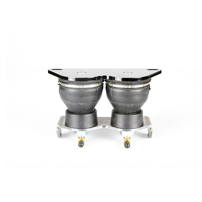 The TC Bros. Air Ride Solo Seat Kit - Single Bag by TC Bros. is a black and silver suspension spring with a mounting bracket, ideal for motorcycle or hardtail chopper seat setups; shown installed under a bicycle seat.