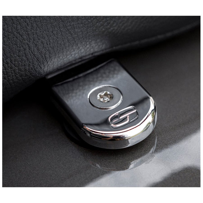 A close up of a car key with a Saddlemen - ATAB Security Seat Screw - Chrome on it, providing security.