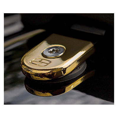 A Saddlemen - ATAB Security Seat Screw - Gold key holder on a Harley car.