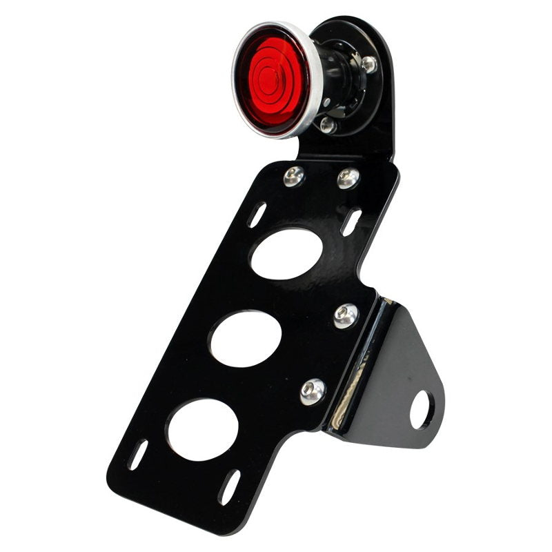 A black TC Bros. 2 Inch Round Bobber Side Mount Tail Light/License Plate Bracket with a red light featuring a self-grounding 12 Volt Brake/Tail Lamp.