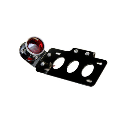 A TC Bros. 2 Inch Round Bobber Side Mount Tail Light/License Plate Bracket with a self grounding 12 Volt Brake/Tail Lamp.