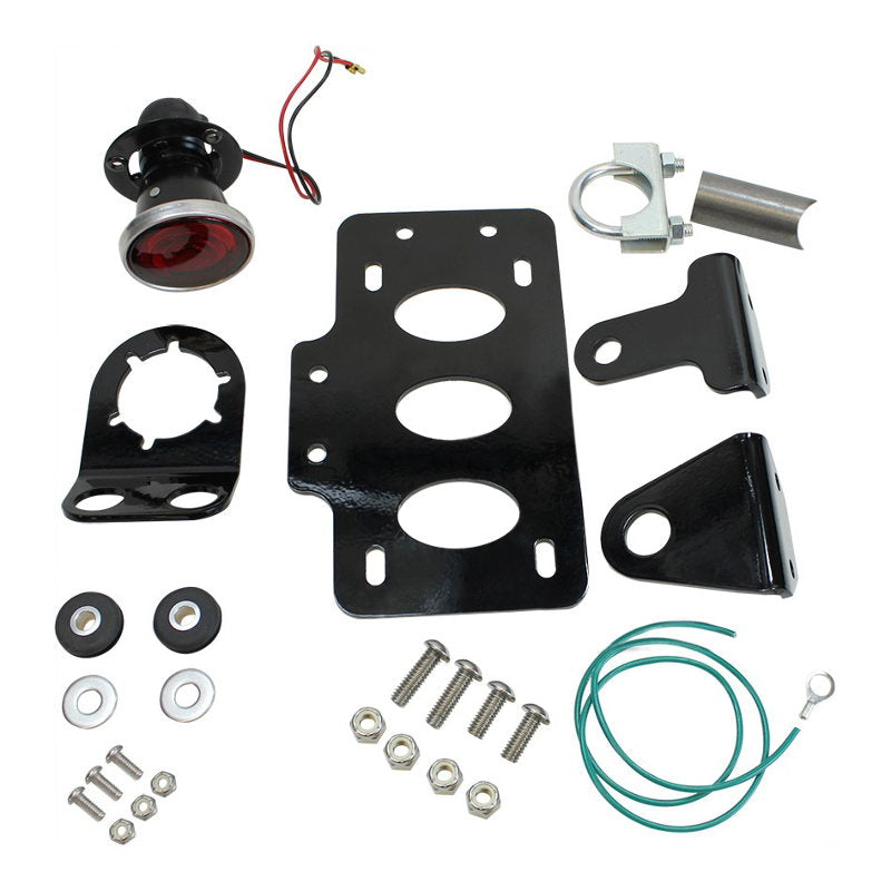 A modular set of parts and hardware, including a TC Bros. 2 Inch Round Bobber Side Mount Tail Light/License Plate Bracket and a self grounding 12 Volt Brake/Tail Lamp, designed for a motorcycle.