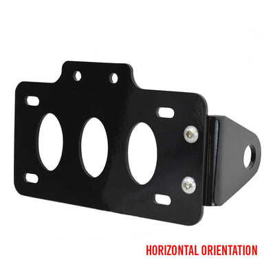 A TC Bros. Side Mount License Plate Bracket (with no light) with four holes for side mount, offering mounting options for a horizontal orientation.