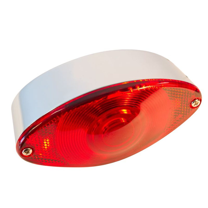 A TC Bros. Cat Eye Tail Light on a white background featuring a License Plate Light.