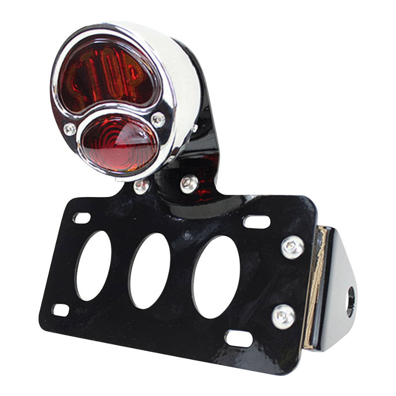 TC Bros. motorcycle enthusiasts can enhance their ride with a TC Bros. "Stop" Model A side mount license plate bracket. This innovative TC Bros. tail light bracket provides both style and functionality, keeping your license plate securely in place while riding a Harley-Davidson motorcycle.