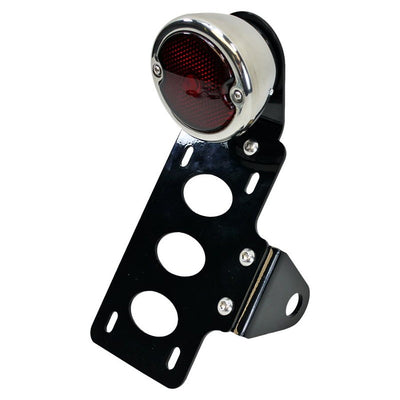 A TC Bros. motorcycle tail light with a red light and a TC Bros. 33 Ford Replica side mount license plate bracket.