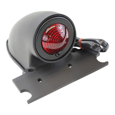 A Moto Iron® Black Sparto Tail Light with a 12 Volt red light, self grounding, and a black die cast housing.