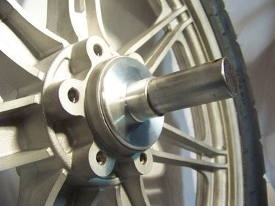 A close up of a Hughs HandBuilt Yamaha XS650 Speedometer Eliminator (fits 1975-1983) wheel with a metal hub.