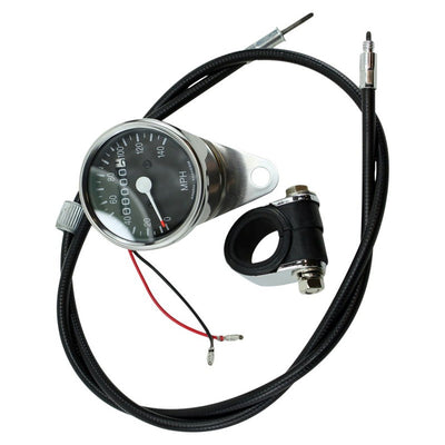 A Biker's Choice Mini Speedometer Kit Fits Sportster Late 1973-1994, 73-94 FX, FXR with a chrome mounting clamp and speedo cable.