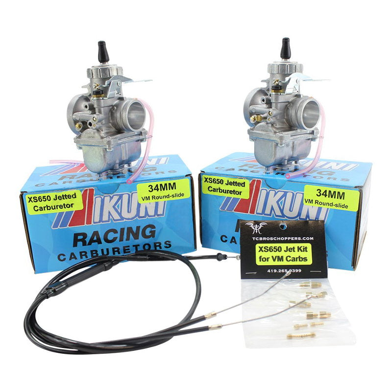 Two Mikuni 34MM VM round-slide performance carburetors for Yamaha XS650 are shown with a cable set and a Mikuni Carb Kit tuned by TC Bros. for Yamaha XS650 1976-1984 in front.