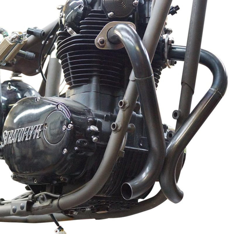 A close up of a black engine motorcycle with a custom Pandemonium "Double D" Exhaust System by Pandemonium.