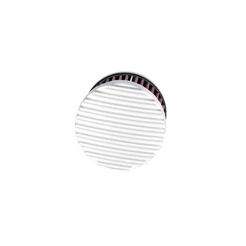 A TC Bros. vintage style white button with a red stripe on it.